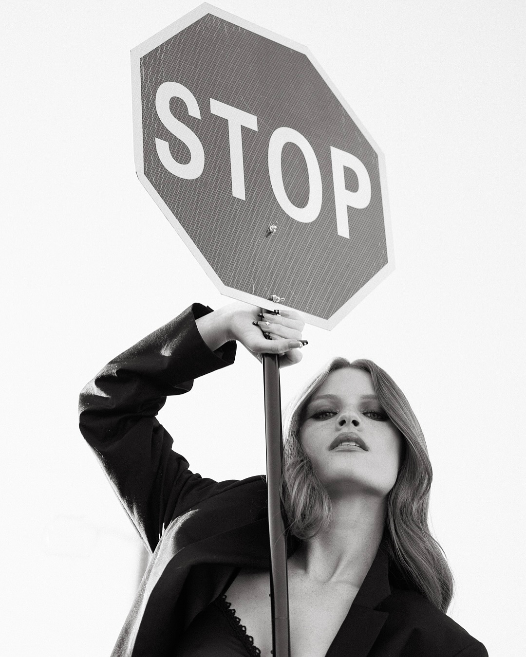 Jade Patteri, black and white editorial with a stop sign